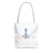 White tote bag with 'Serenity' text and silhouette design on a white background