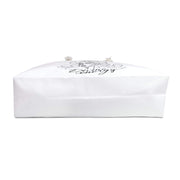 White strapless top with floral design and text on a white background