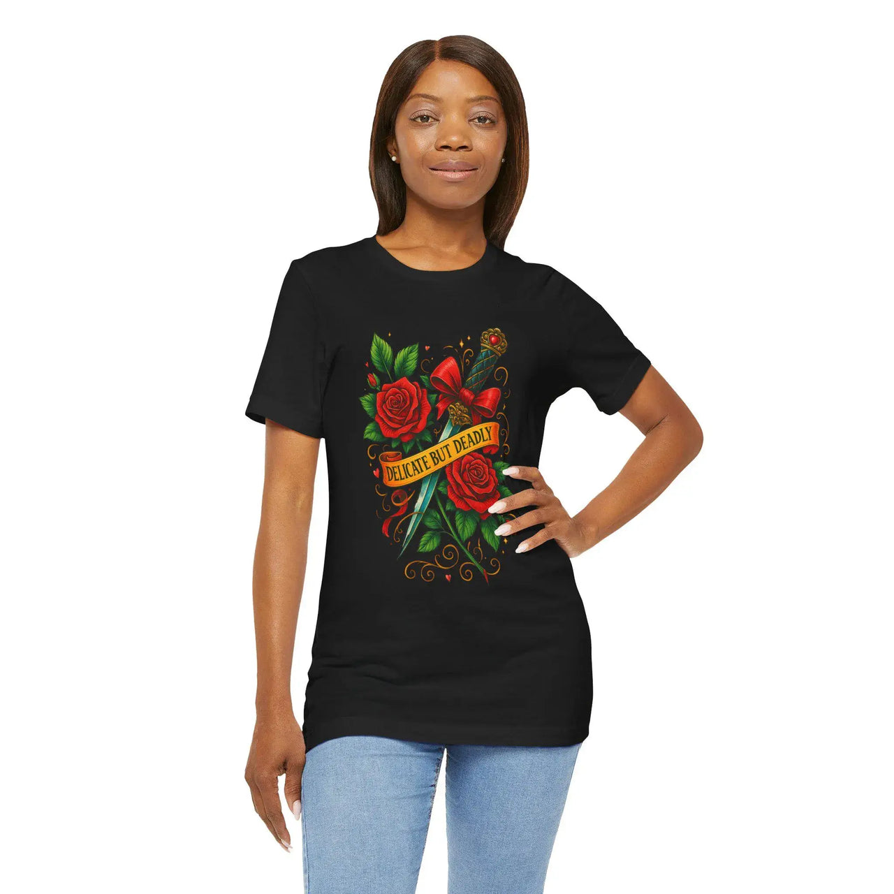 Woman wearing a black t-shirt with a graphic design of roses and text.