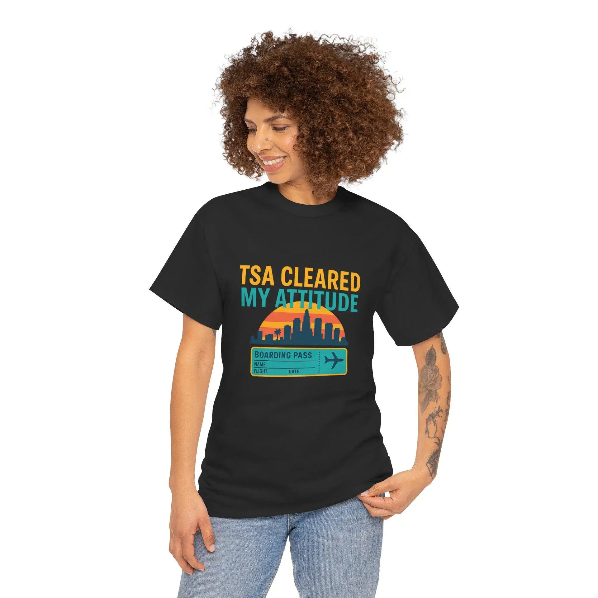 Person wearing a black t-shirt with 'TSA Cleared My Attitude' design on a white background