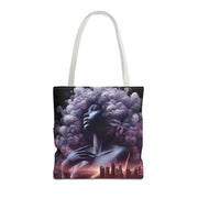 Tote bag with a stylized design of a woman with an afro and cityscape in the background on a white background.