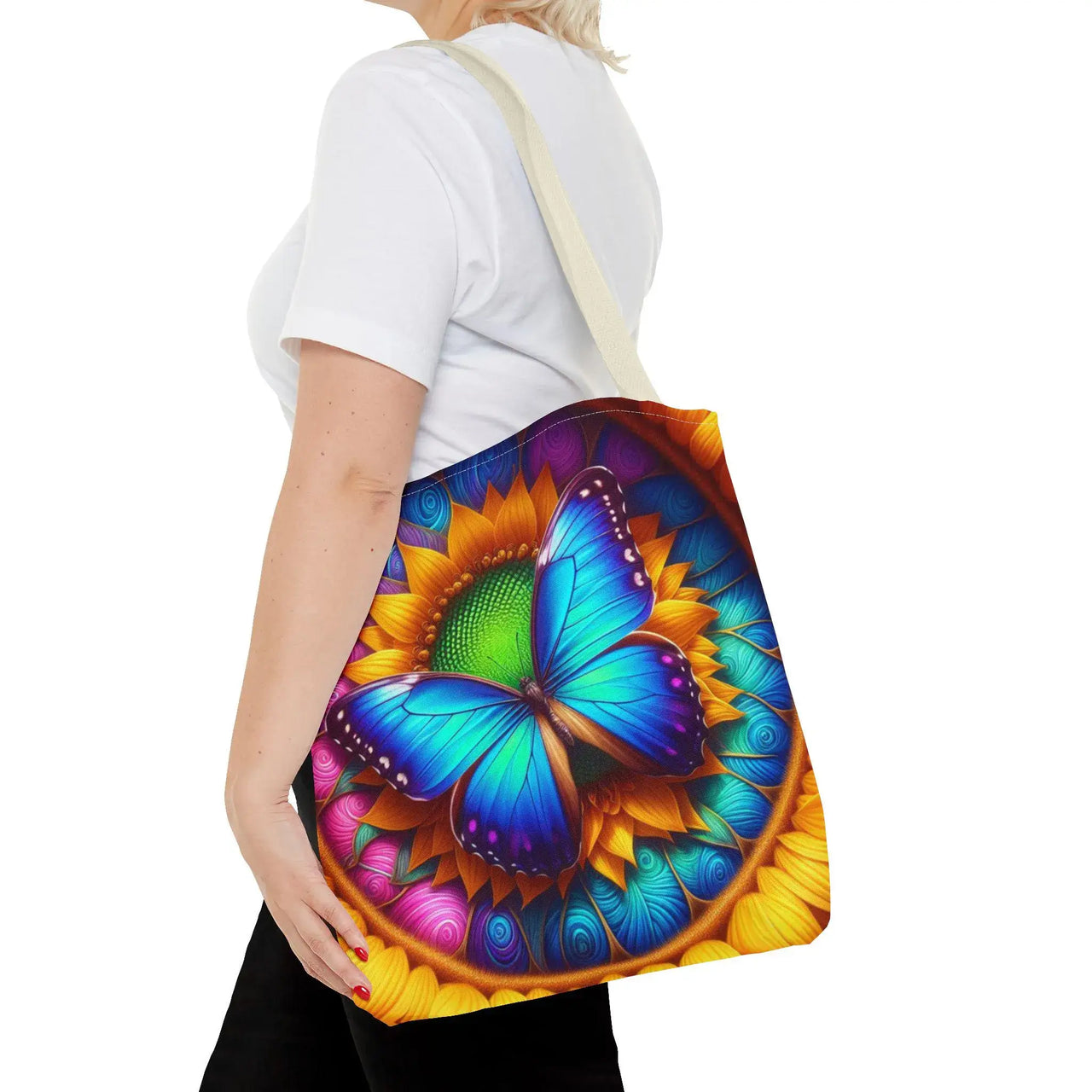 Person holding a colorful bag with a butterfly design on a white background