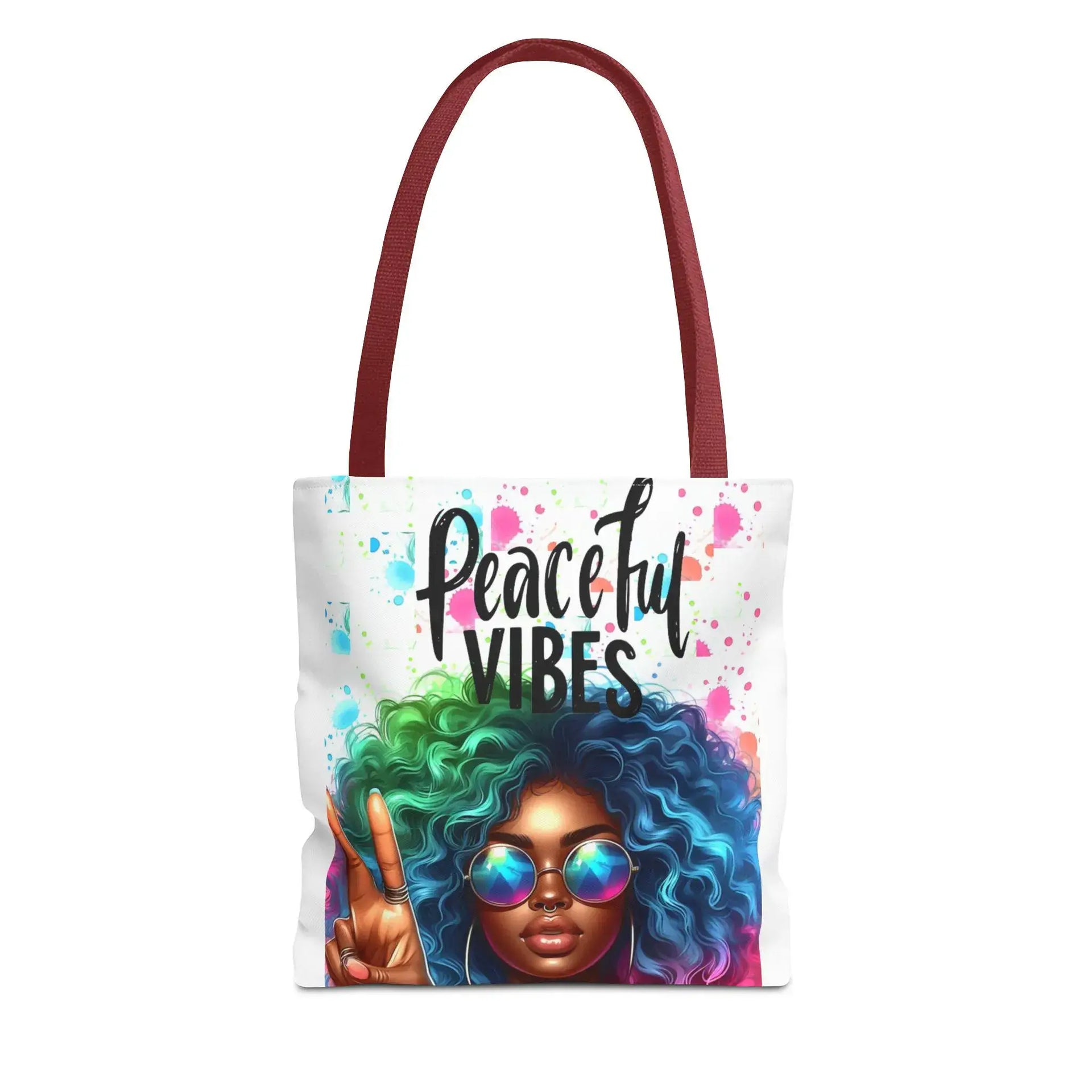 Tote bag with a colorful design of a woman with afro hair and 'Peaceful Vibes' text on a white background.