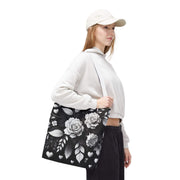 Person wearing a white hoodie and black floral skirt with a white cap on a white background