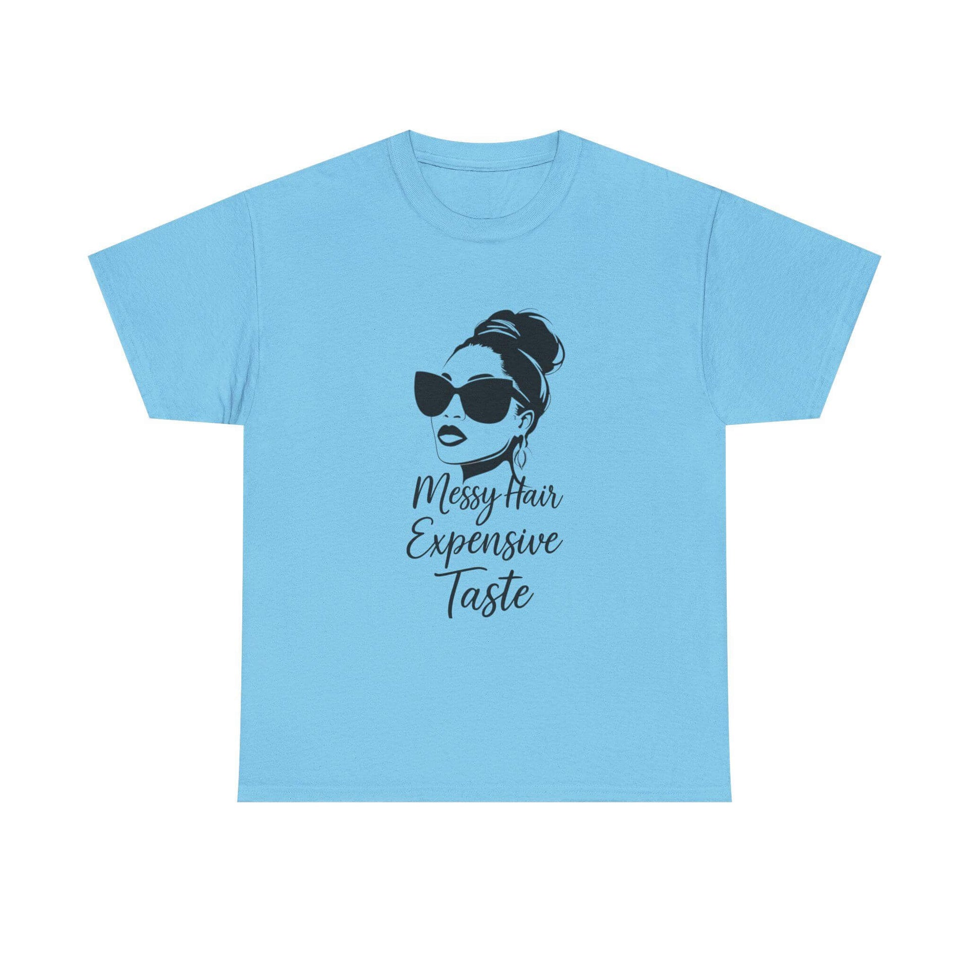Light blue t-shirt with a graphic of a woman with messy hair and sunglasses and text on a white background